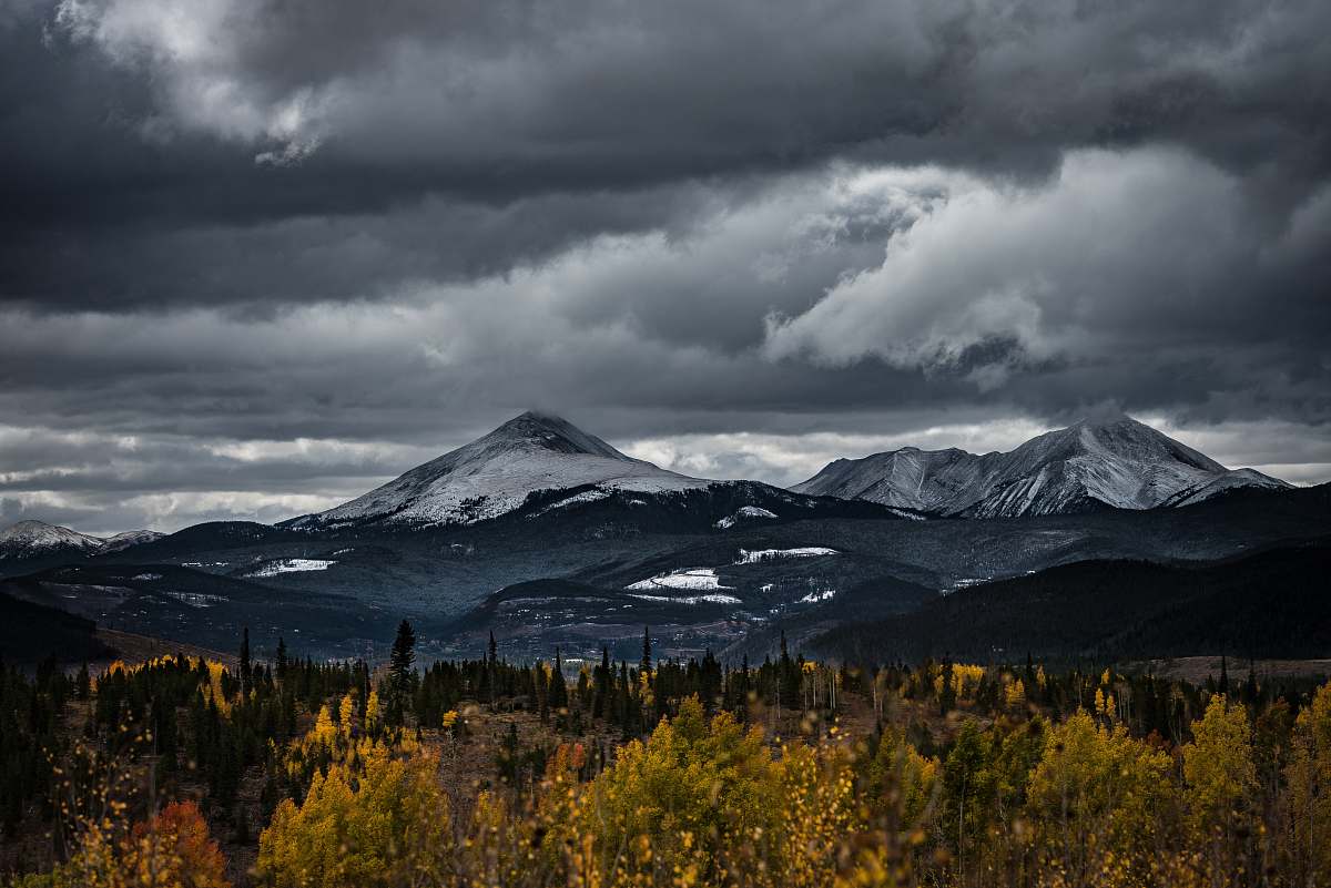 mountain range snow capped mountain under cloudy sky peak